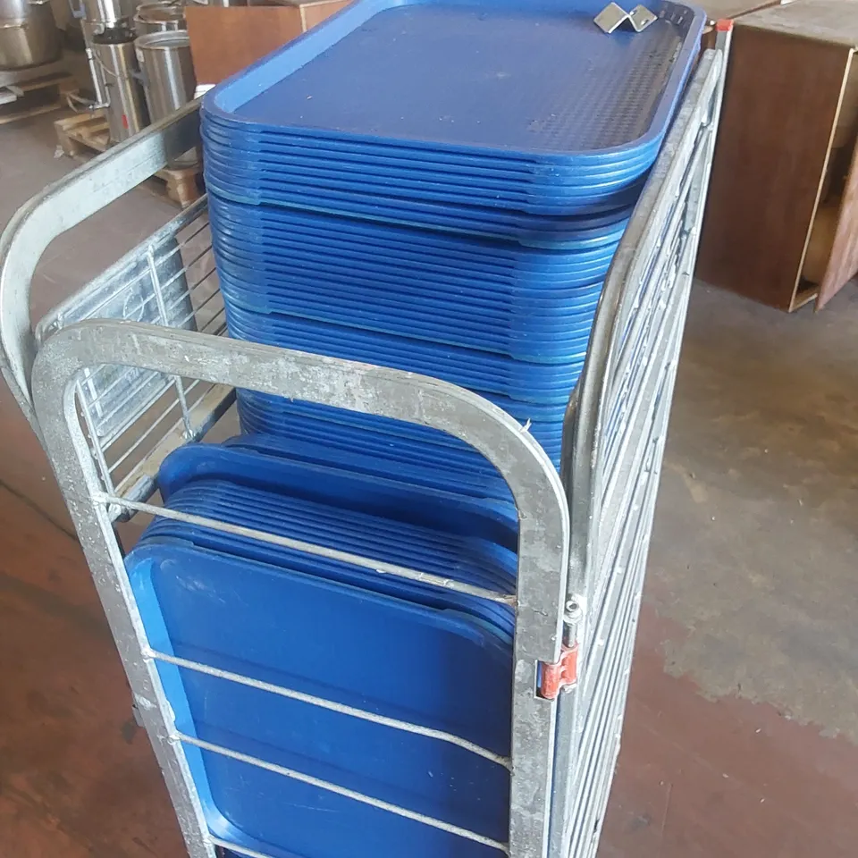 CAGE TO CONTAIN A LARGE QUANTITY OF BLUE PLASTIC SERVING TRAYS 