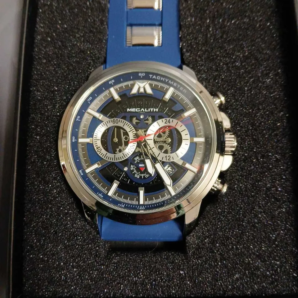 BOXED MEGALITH SKELETON FACED GENTS WATCH WITH STAINLESS STEEL BACK AND BLUE RUBBER STRAP