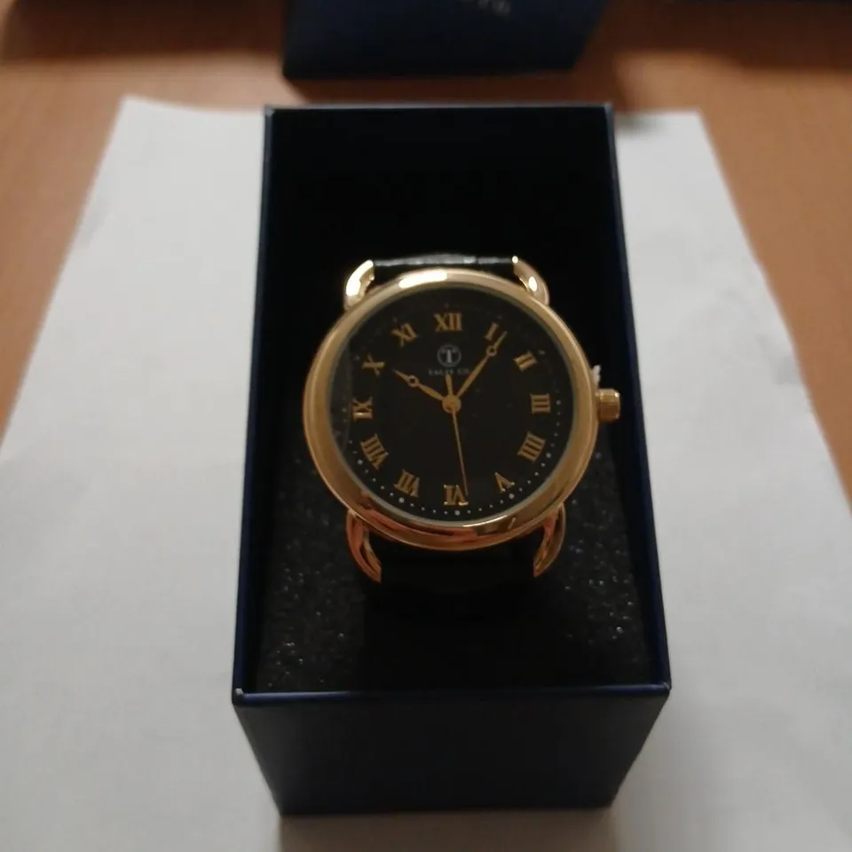 TALIS CO. GOLD-TONE WRISTWATCH WITH BLACK DIAL AND BLACK STRAP– BOXED