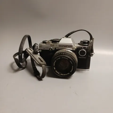 OLYMPUS FILM CAMERA OM 10 LEATHER STRAP INCLUDES MANUAL ADAPTOR