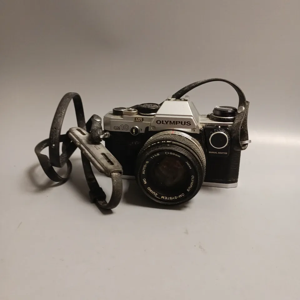 OLYMPUS FILM CAMERA OM 10 LEATHER STRAP INCLUDES MANUAL ADAPTOR