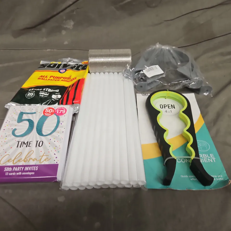 TOTE OF APPROXIMATELY 10 ASSORTED HOUSEHOLD ITEMS TO INCLUDE PARTY INVITES, CAN OPENER AND WALLPAPER ADHESIVE
