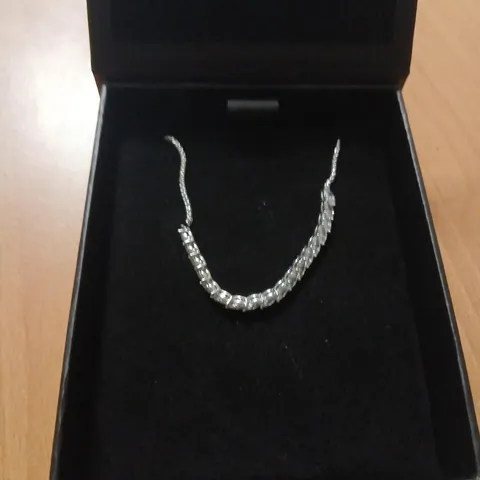 SILVER-TONE TENNIS BRACELET WITH CLEAR STONES