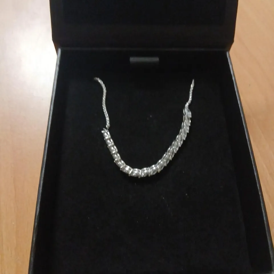 SILVER-TONE TENNIS BRACELET WITH CLEAR STONES 
