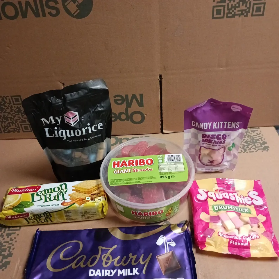 APPROXIMATELY 15 ASSORTED SWEETS AND CHOCOLATE ITEMS TO INCLUDE - HARIBO GIANT STRAWBS, CADBURY DAIRY MILK CHOCOLATE BARS AND LEMON PUFFS