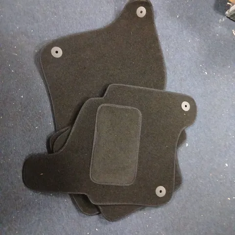 SET OF FOUR BLACK CAR FLOOR MATS WITH HEEL PAD AND ANCHOR POSTS