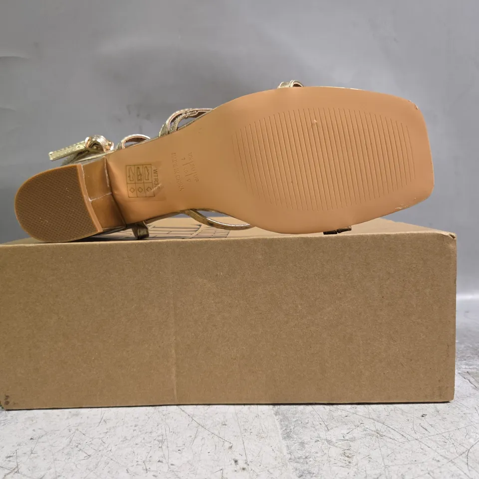 BOXED PAIR OF WHERE'S THAT FROM OPEN TOE BLOCK HEEL SANDALS IN METALLIC GOLD SIZE UK 7