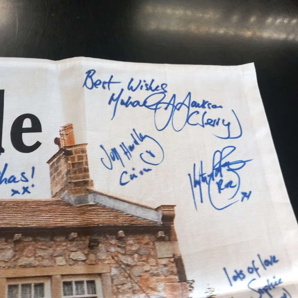 EMMERDALE'THE WOOLPACK' TEA TOWEL SIGNED BY THE CAST