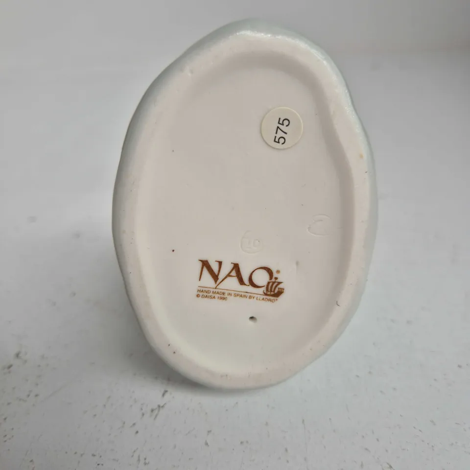NAO LLADRÓ PORCELAIN FIGURINE – BOY HOLDING A DOG