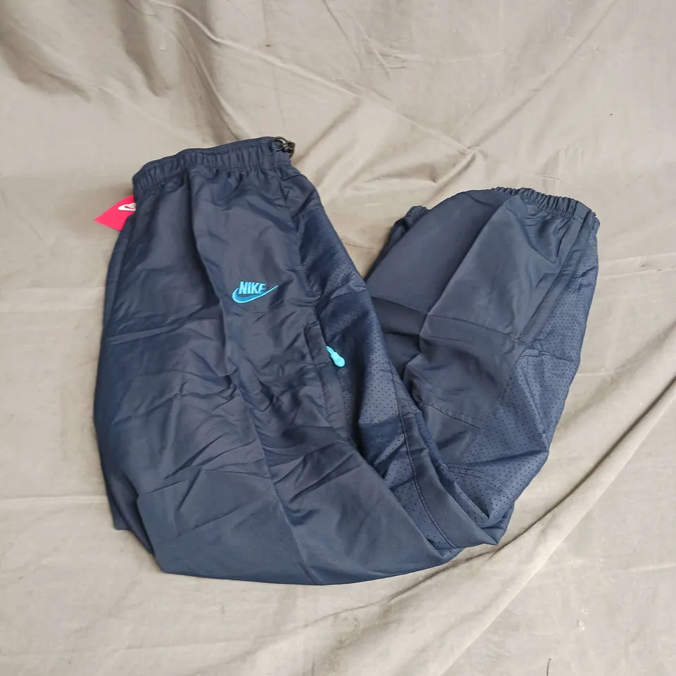 NIKE TRACK PANTS IN NAVY SIZE M