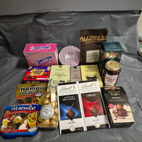 APPROXIMATELY 15 ASSORTED FOOD AND DRINK PRODUCTS TO INCLUDE - CADBURY CREME EGGS - LINDT CHILLI CHOCOLATE - HARIBO STARMIX - ETC