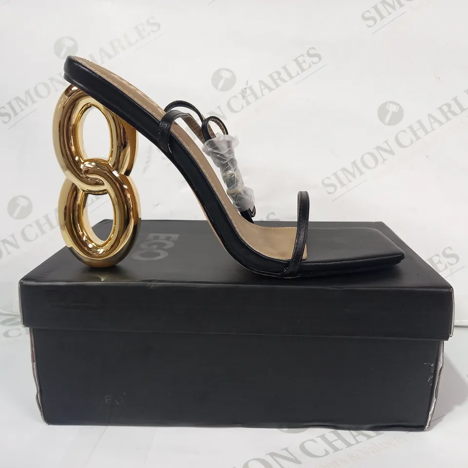 BOXED PAIR OF EGO FARAH OPEN TOE HIGH HEELS IN BLACK/GOLD EFFECT UK SIZE 6