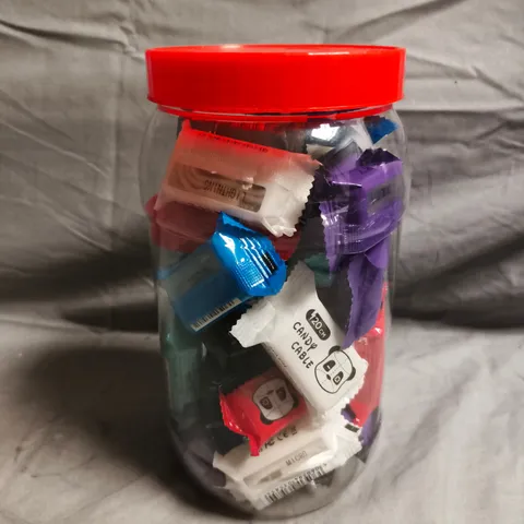 CLEAR PLASTIC CONTAINER OF APPROXIMATELY 20 ASSORTED PATCH PANDA CANDY CABLE DATA WIRES