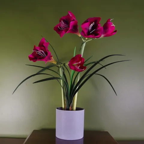 BOXED 60CM FAUX FLOWERING PLANT IN POT