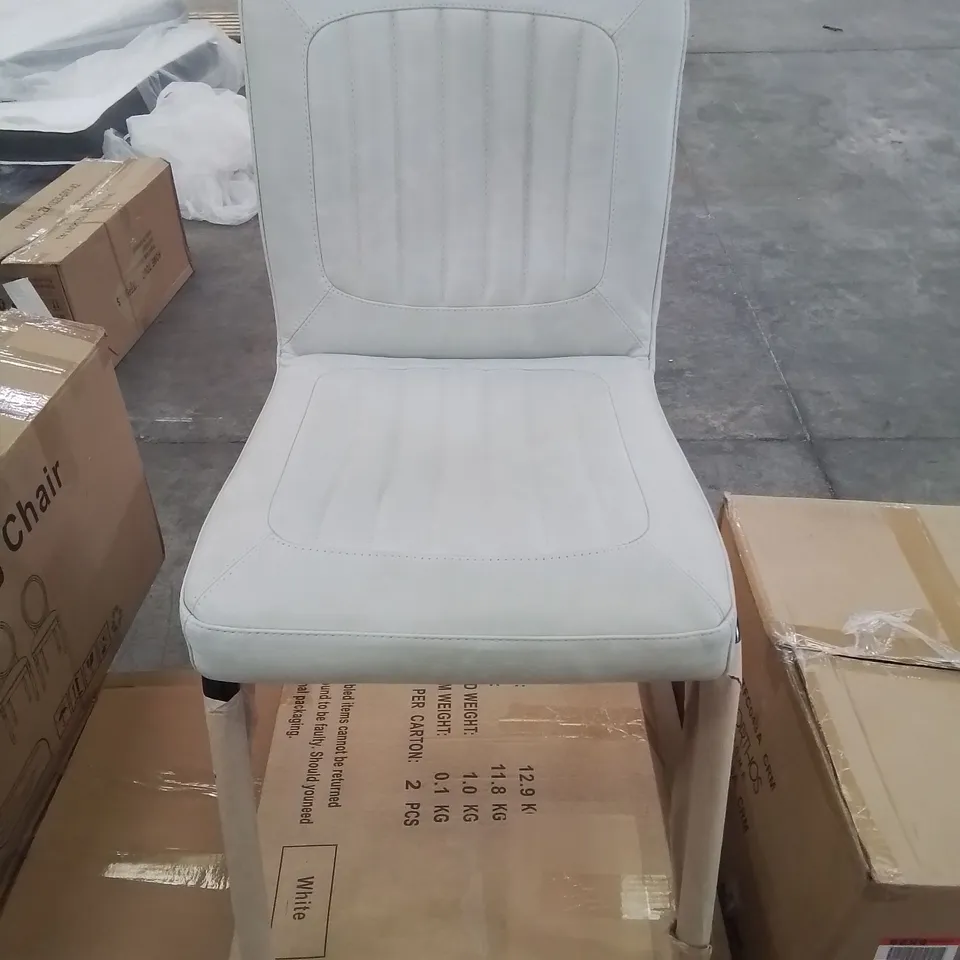 A BOXED LEATHER UPHOLSTERED HEAVY SIDE CHAIR IN TURQUOISE 