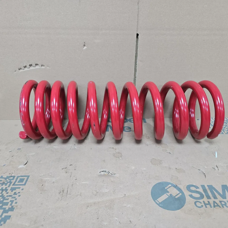 RED COIL SPRING – VEHICLE SUSPENSION PART (MODEL UNSPECIFIED)