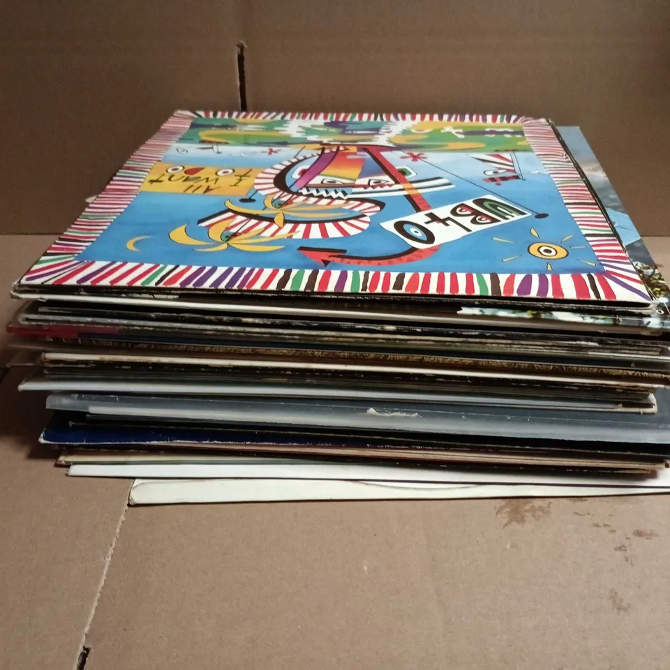 APPROXIMATELY 20 ASSORTED VINYL'S TO INCLUDE ARTISTS SUCH AS ACDC, UB40, ADAM AND THE ANTS, ETC - COLLECTION ONLY