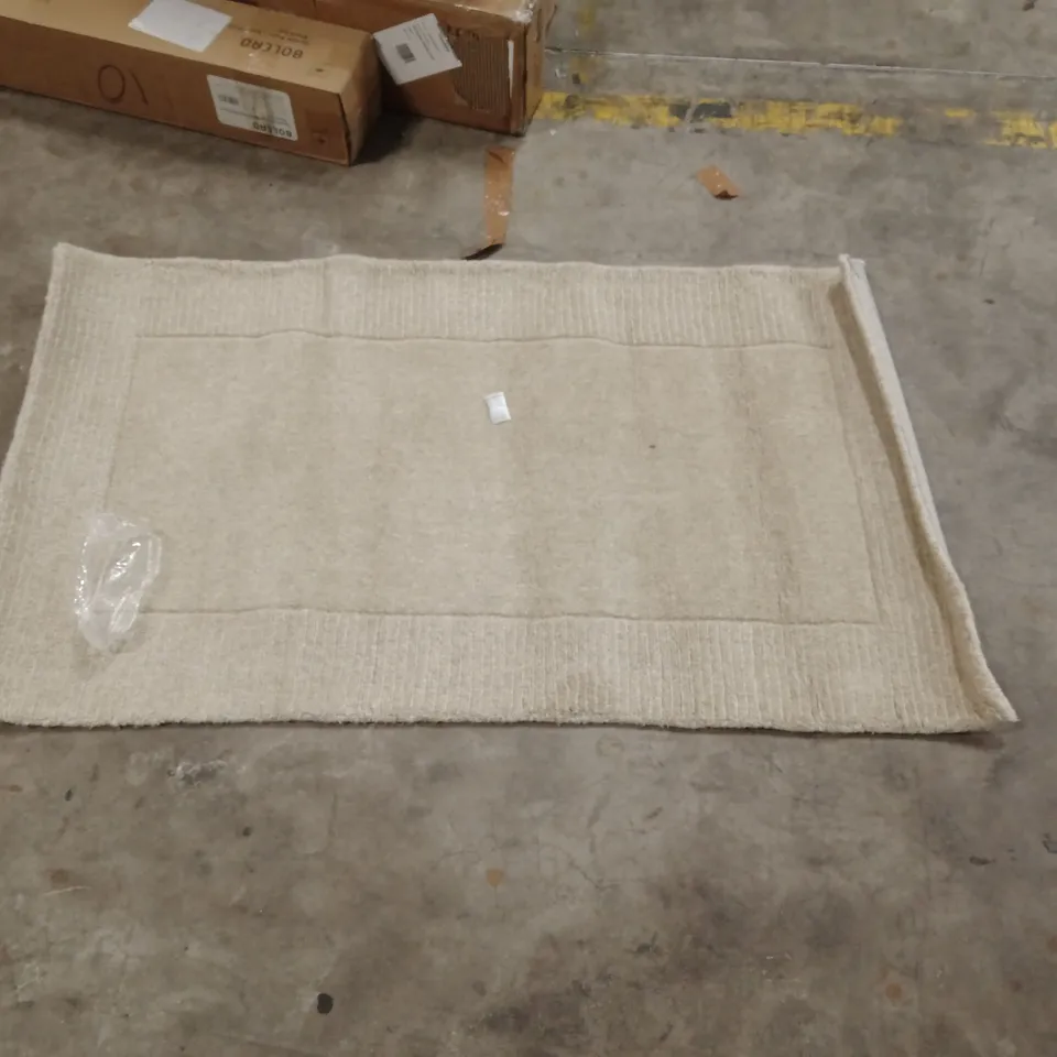 CAGE OF APPROXIMATELY 25 DESIGNER RUGS
