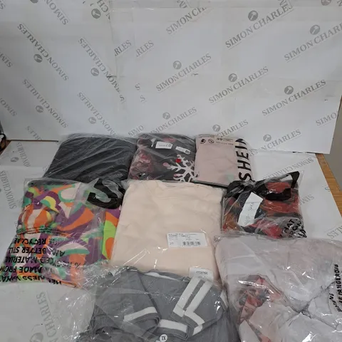 LARGE BOX OF ASSORTED CLOTHING ITEMS IN VARIOUS COLOURS AND SIZES INCLUDING TROUSERS , TOPS AND JUMPERS