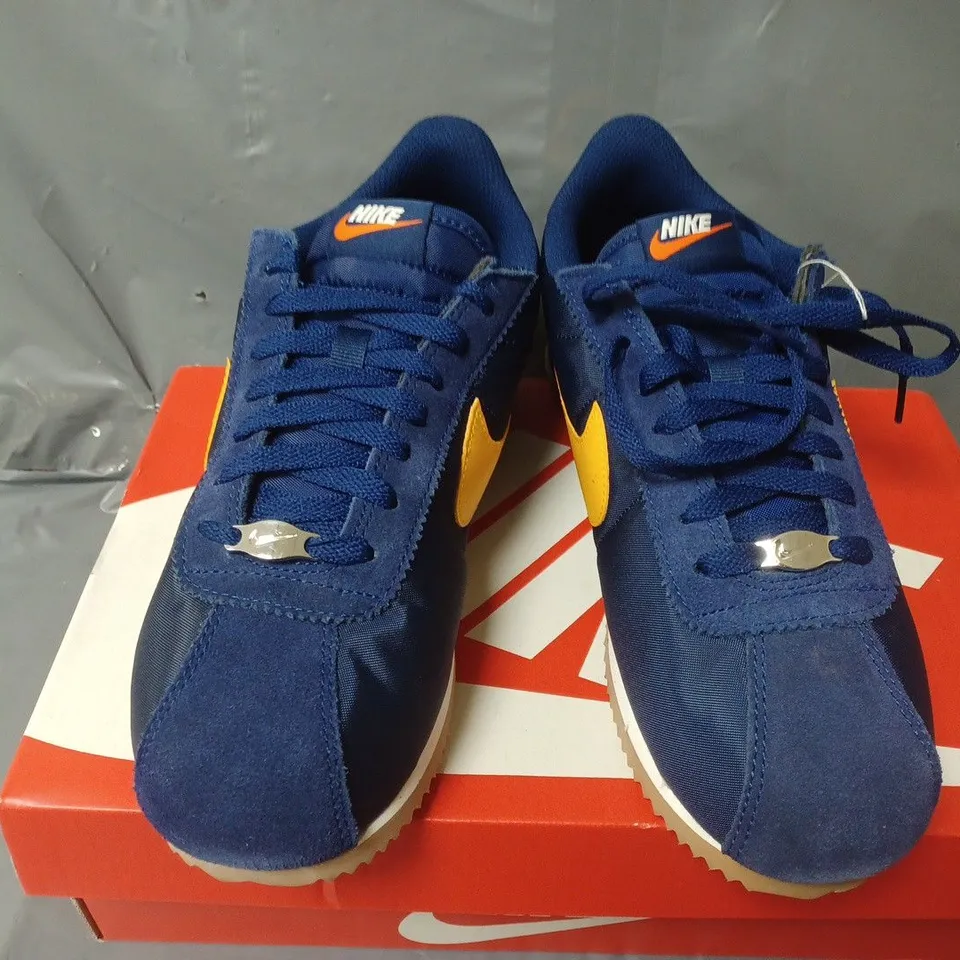 BOXED PAIR OF NIKE CORTEZ TRAINERS IN NAVY/YELLOW - UK 7.5