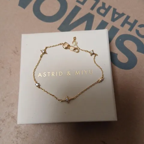 ASTRID & MIYU GOLD-TONE CHILDS BRACELET WITH CRYSTAL STAR ACCENTS