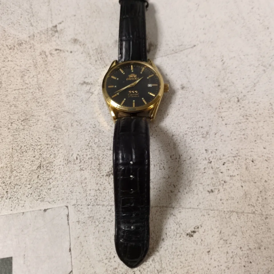 ORIENT CRYSTAL 21 JEWELS GOLD TONE WATCH WITH BLACK DIAL