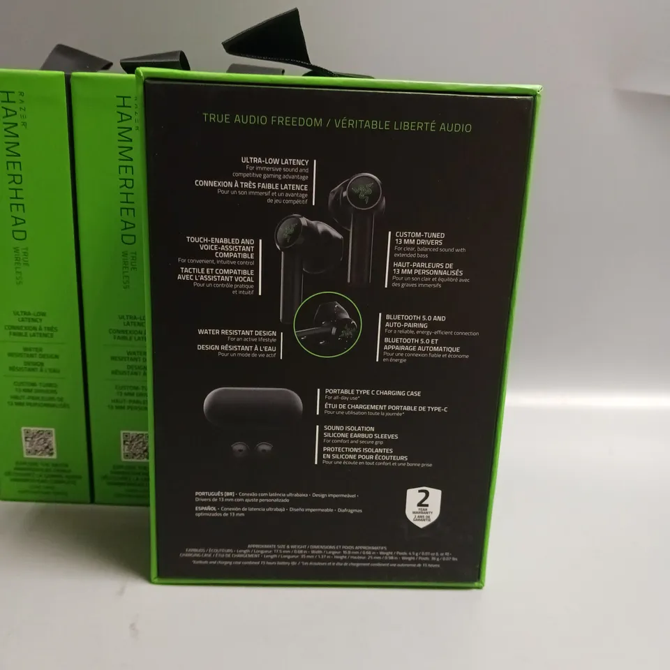 LOT OF 5 BOXED RAZER WIRELESS HEADPHONES IN BLACK AND GREEN INCLUDES CHARGING CASE, CABLE AND WRIST STRAP
