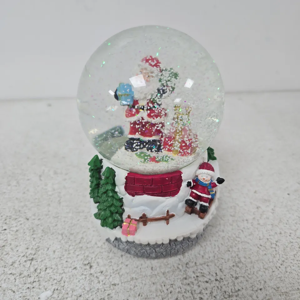 BOXED CELEBRIGHT SANTA & CHILD SLEDGING LED MUSICAL SNOWGLOBE