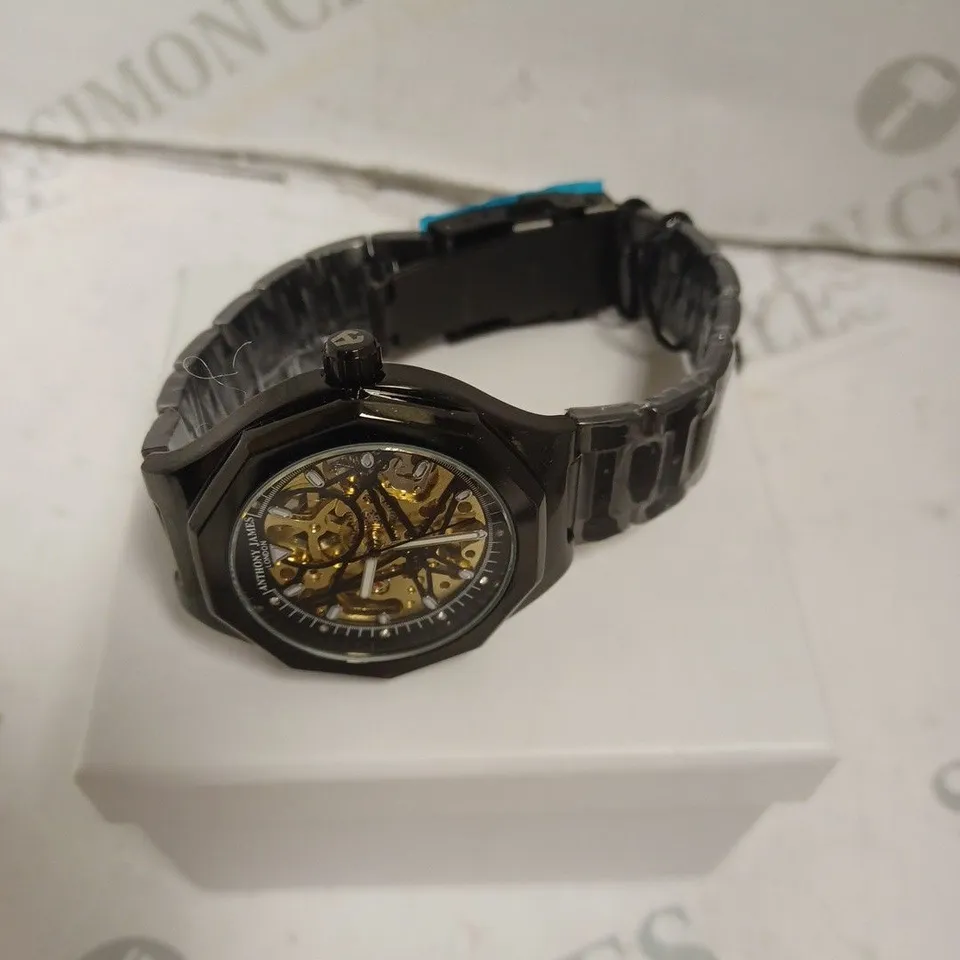 BOXED ANTHONY JAMES GENTS SPORTS SKELETON WATCH WITH STAINLESS STEEL BRACELET. 