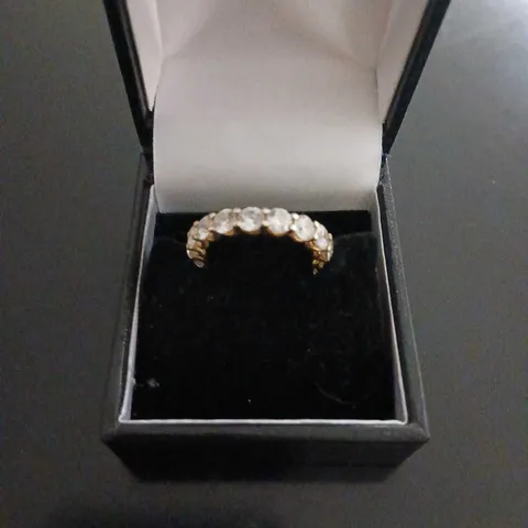 YELLOW GOLD-TONE RING WITH CLEAR STONES