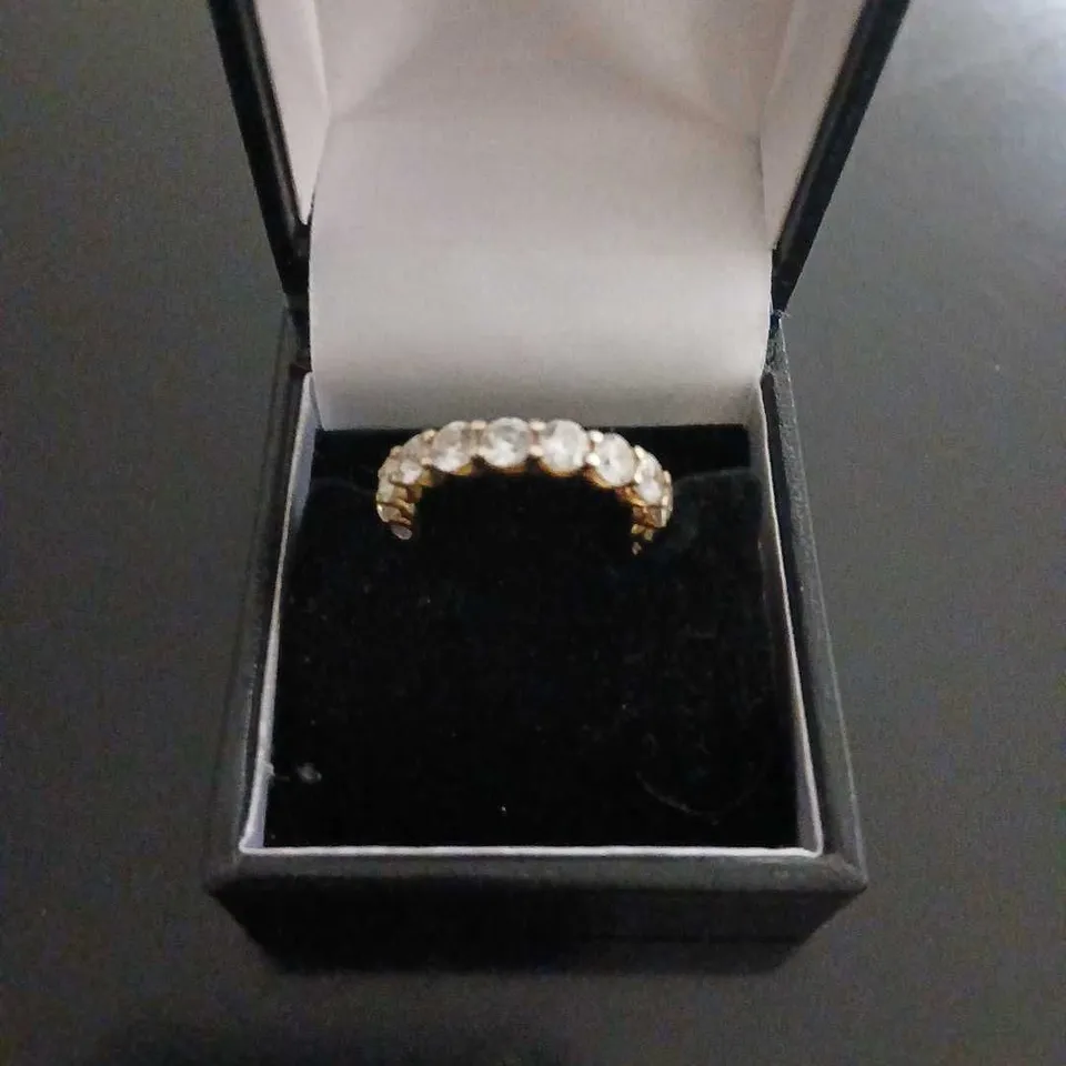 YELLOW GOLD-TONE RING WITH CLEAR STONES