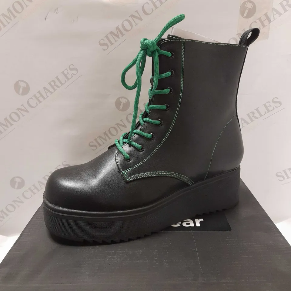 KOI BLACK PU/GREEN STITCHES LACE UP BOOTS - SIZE 6