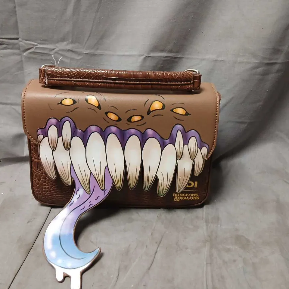 KOI DUNGEONS & DRAGONS HANDBAG WITH MONSTROUS TEETH MOUTH GRAPHIC – BROWN FAUX LEATHER