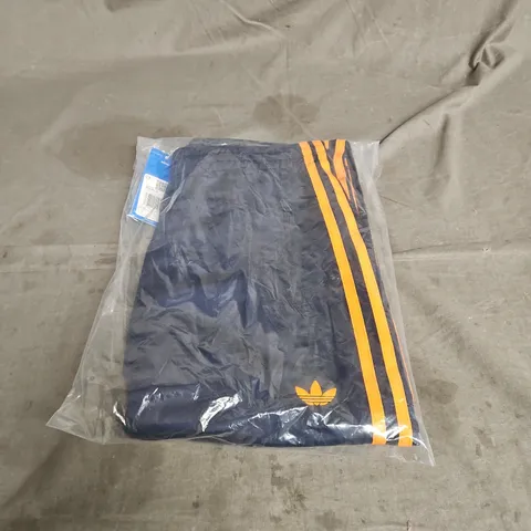 BAGGED ADIDAS FIREBIRD TRACK PANTS IN INDIGO/ORANGE SIZE S