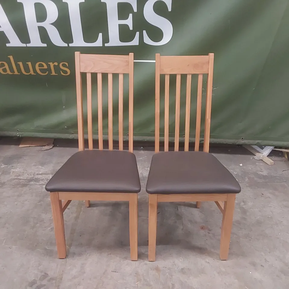 PAIR OF DESIGNER WOODEN DINING CHAIRS WITH PADDED UPHOLSTERED SEATS