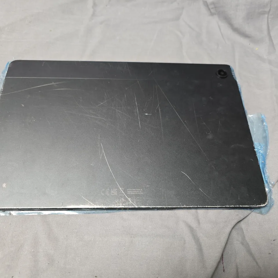 SAMSUNG SILVER TABLET DEVICE – REAR CAMERA VISIBLE