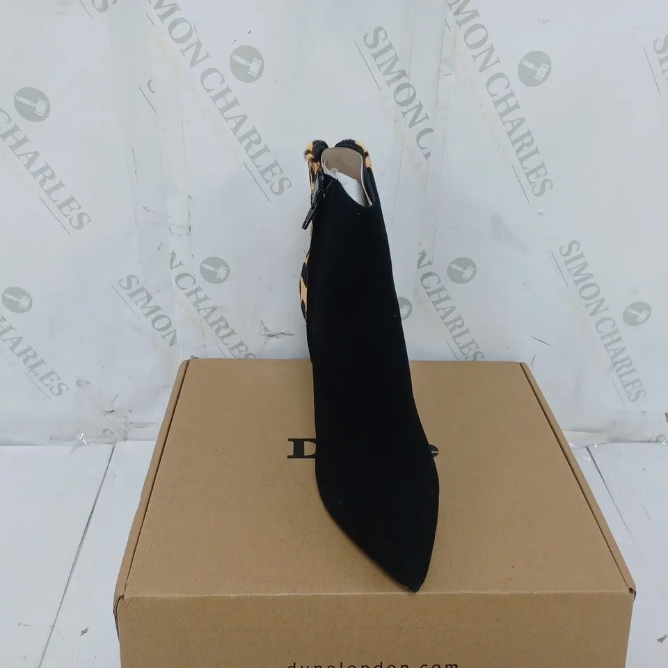 BOXED PAIR OF DUNE HEELED BOOTS IN LEOPARD SIZE 6