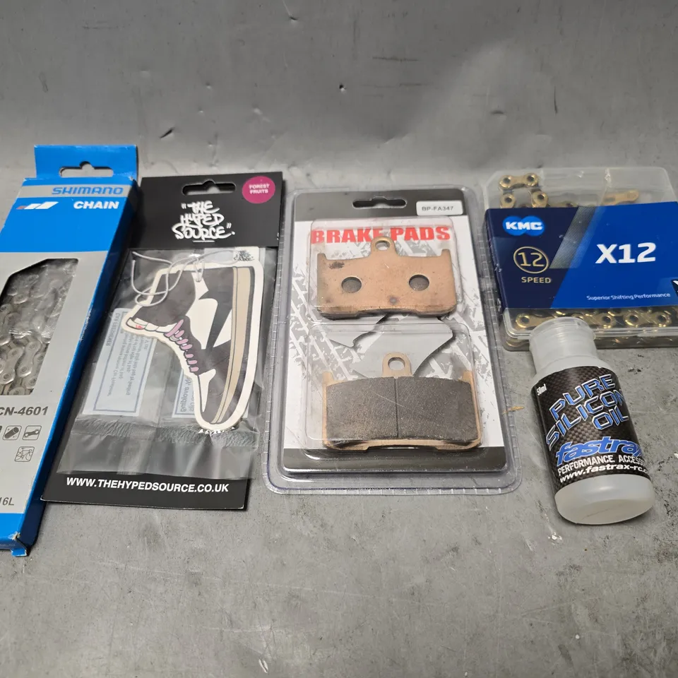 APPROXIMATELY 7 ASSORTED ITEMS TO INCLUDE - KMC X12 , BRAKE PADS , SHIMANO CHAIN 10S ETC