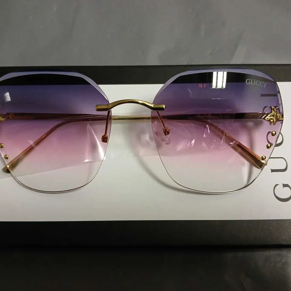 BOXED PAIR OF GUCCI GLASSES