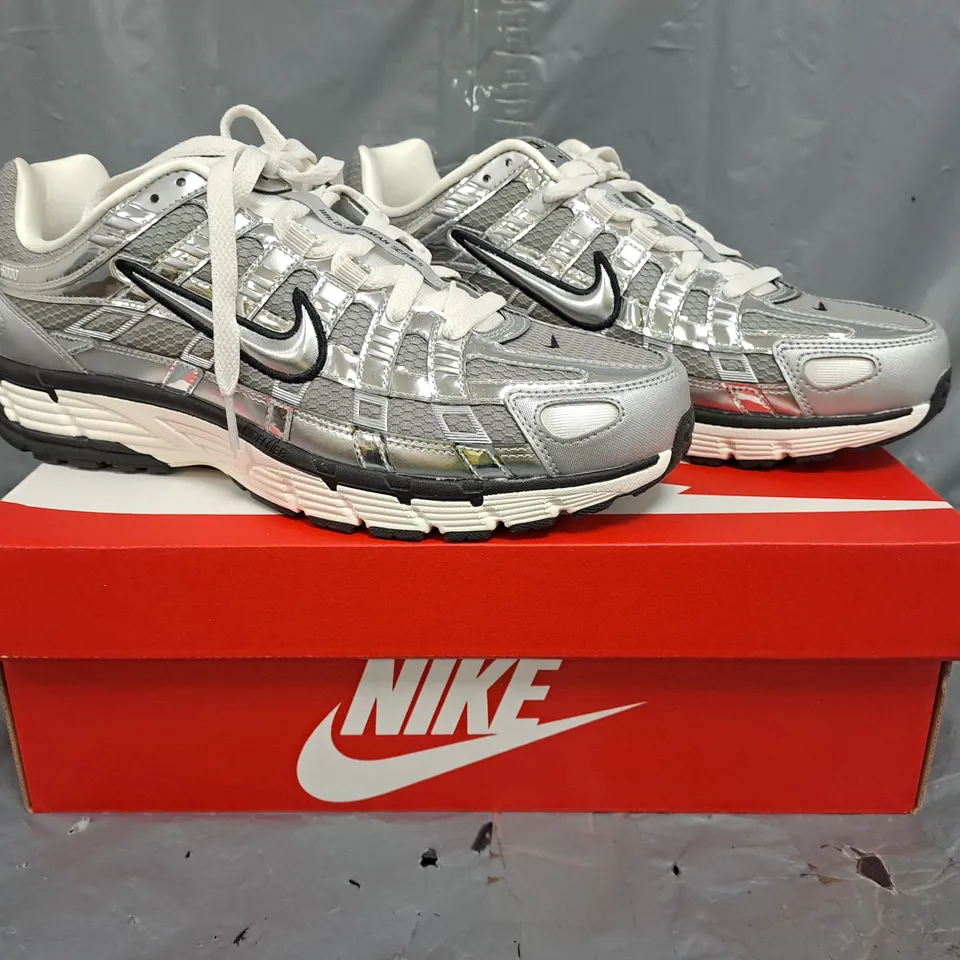 BOXED PAIR OF NIKE P-6000 TRAINERS IN METALLIC SILVER UK SIZE 8.5