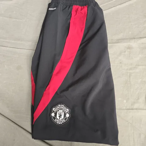 MANCHESTER UNITED ADIDAS TRACK PANTS – BLACK WITH RED STRIPE, MEN'S SIZE M