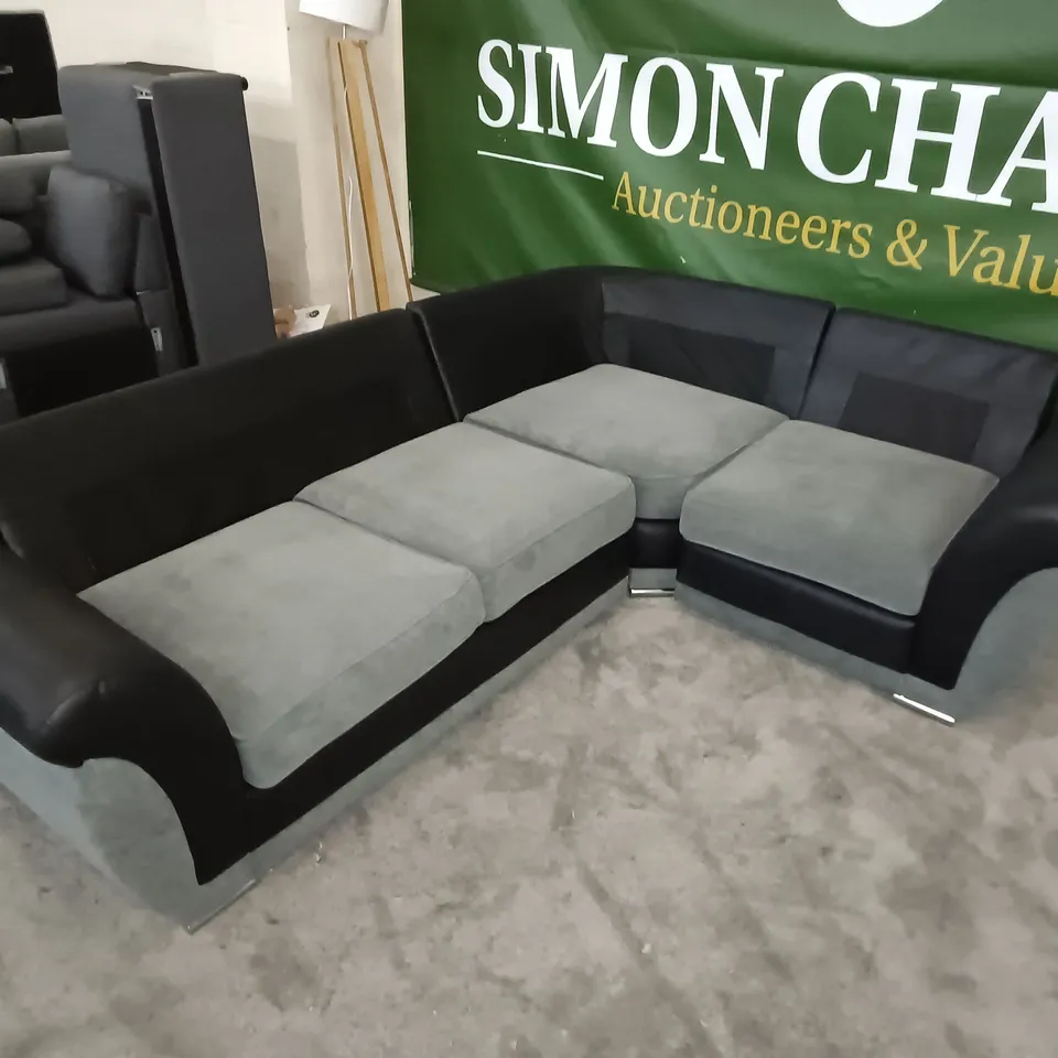 TWO-TONE GREY FABRIC WITH BLACK FAUX LEATHER CORNER SOFA WITH CHROME DETAIL - NO BACK CUSHIONS