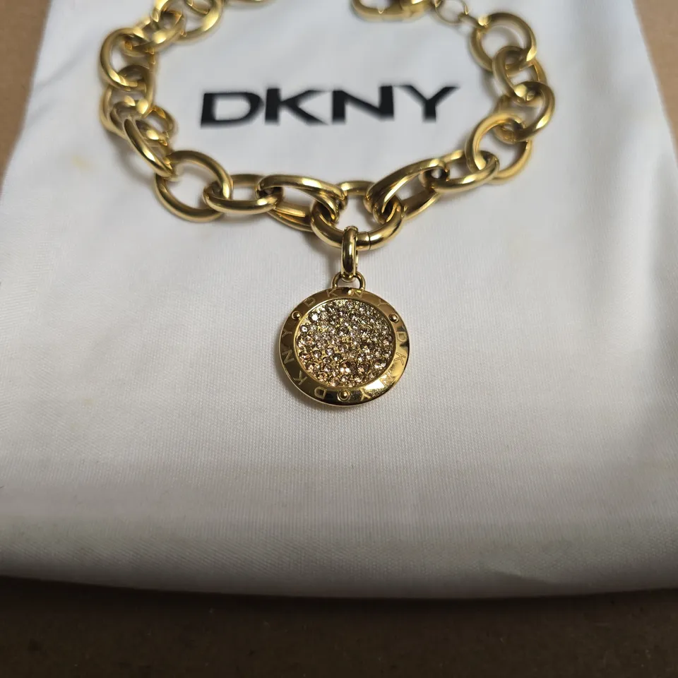 DKNY GOLD TONE PENDANT BRACELET 