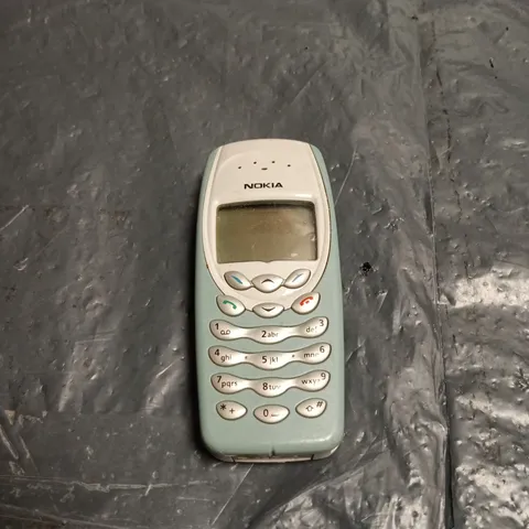 NOKIA MOBILE PHONE – CLASSIC KEYPAD, TEAL BODY 
