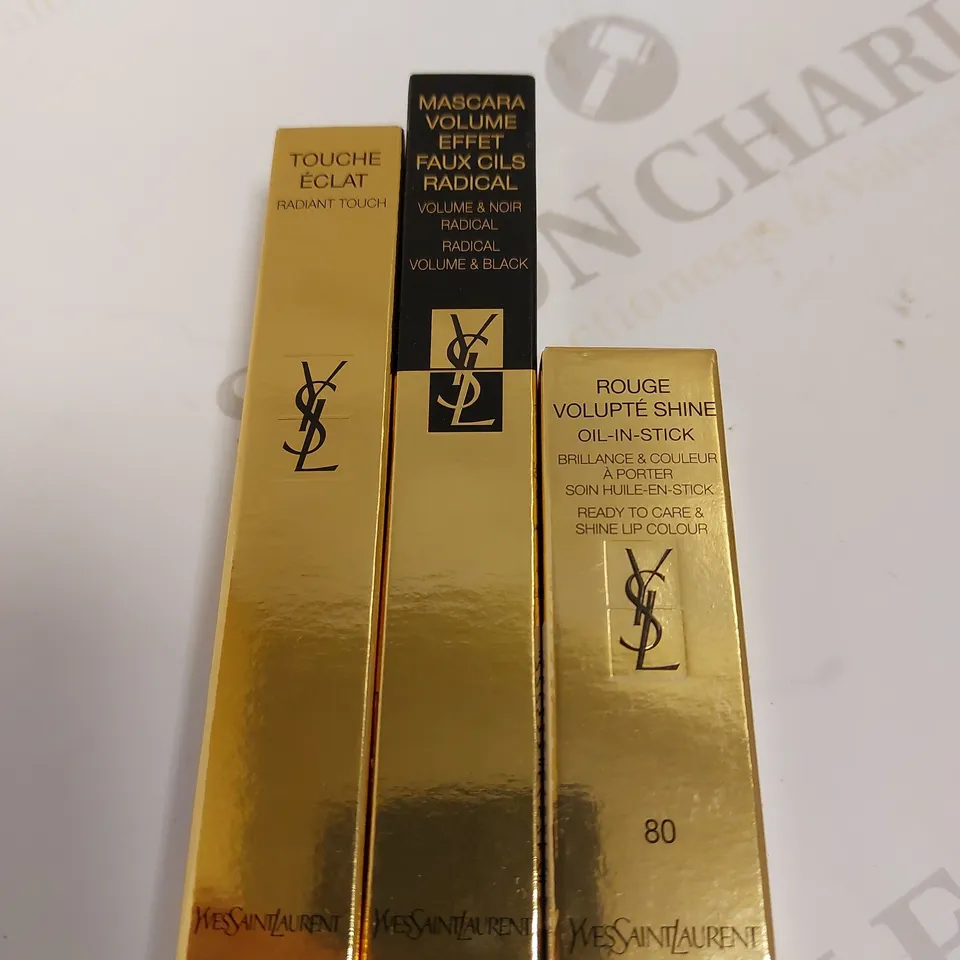 BOX OF 3 YVES SAINT LAURENT ITEMS TO INCLUDE VOLUME MASCARA, SHINE LIP COLOUR AND RADIANT TOUCH PEN