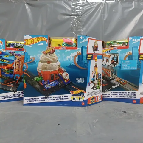 BOX OF 3 HOT WHEELS CITY TOY SETS TO INCLUDE TUNE UP SHOP, CAR PARK, AND ICE CREAM SWIRL