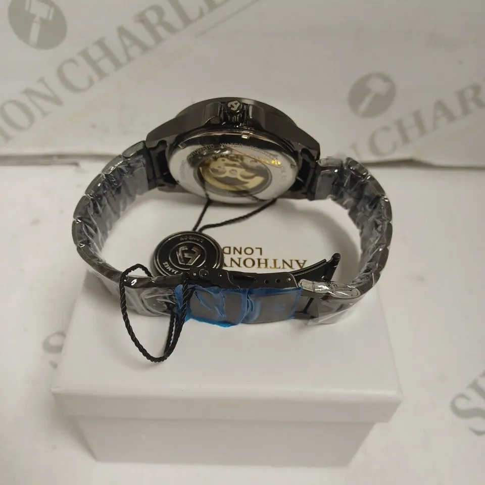 BOXED ANTHONY JAMES WATCH - AUTOMATIC - WATER RESISTANT 3ATM - SKELETON FACE - STAINLESS STEEL BLACK. 