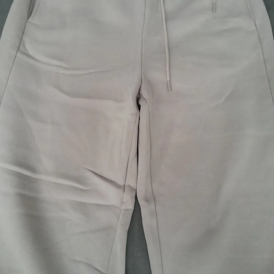 DESIGNER JOGGERS IN BEIGE SIZE XL