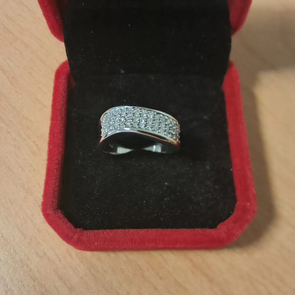 18CT WHITE GOLD WAVE RING SET WITH NATURAL DIAMONDS