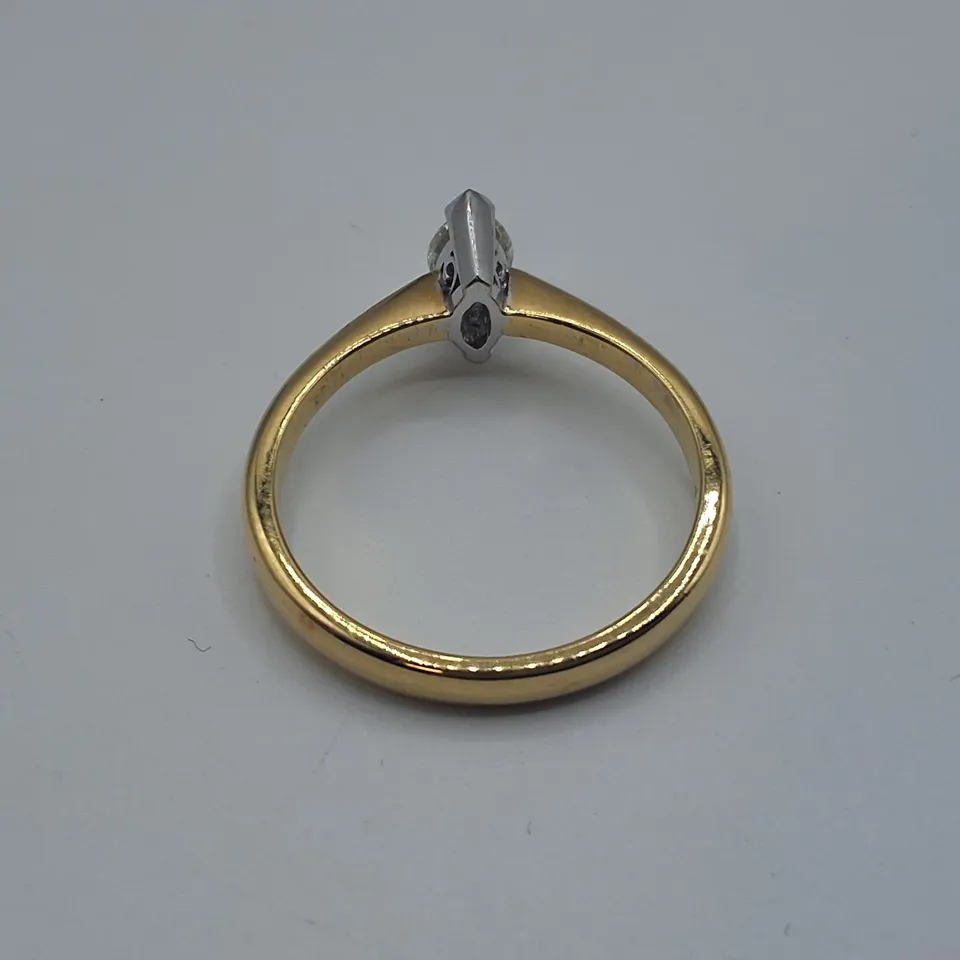 18CT GOLD SOLITAIRE RING SET WITH A NATURAL MARQUISE CUT DIAMOND